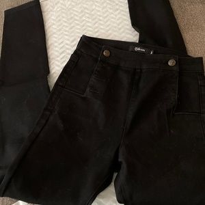 Black pants with anchor buttons